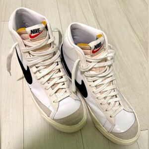 Nike Women’s White Black High-Top Sneakers with Orange Accent